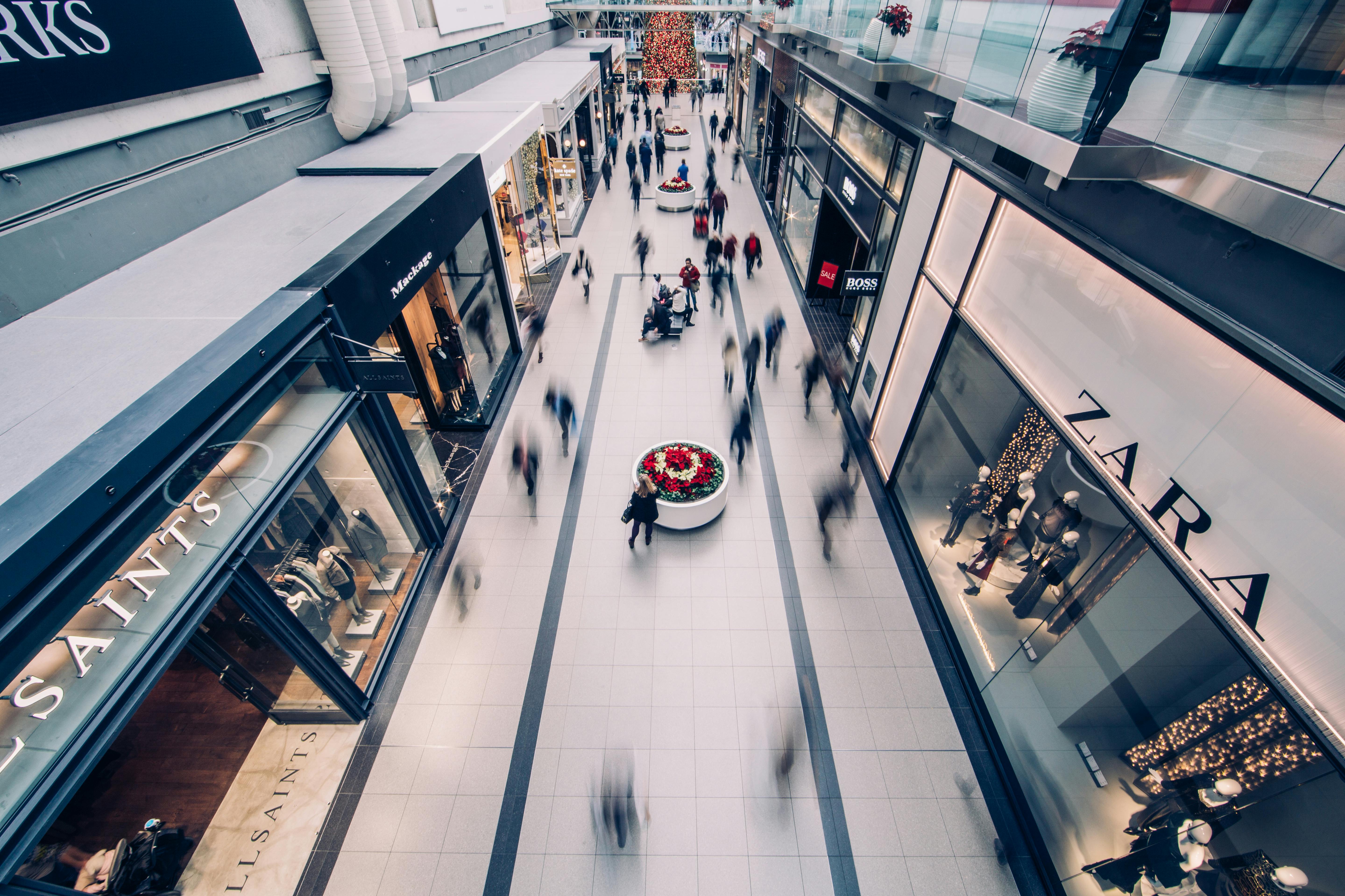 people walking through a mall