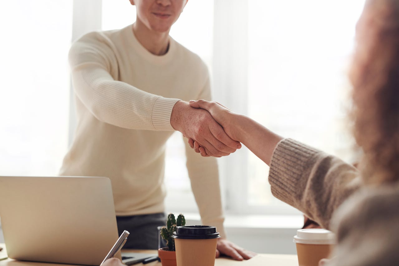 two-people-shaking-hands two-people-shaking-hands