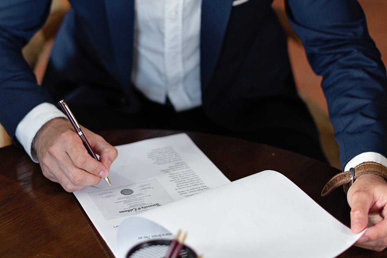 person-signing-documents person-signing-documents