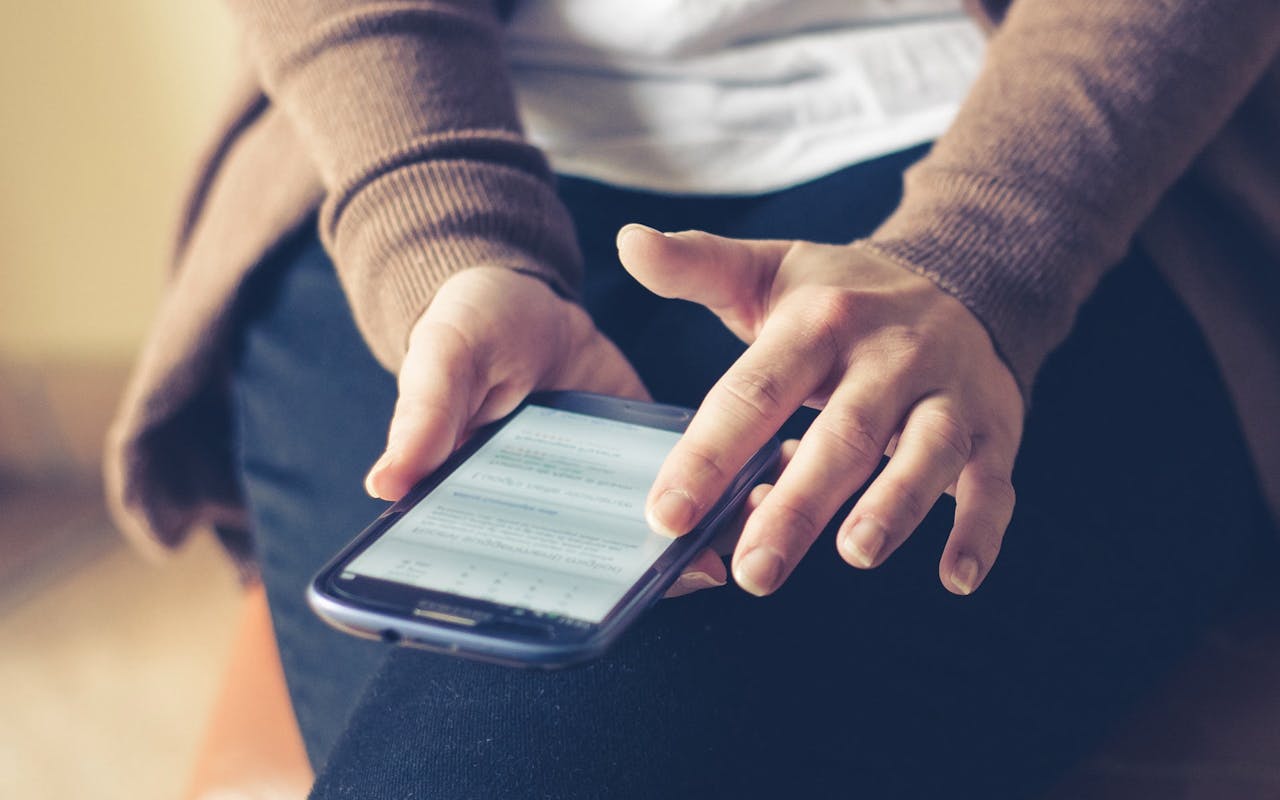 person-scrolling-on-phone person-scrolling-on-phone