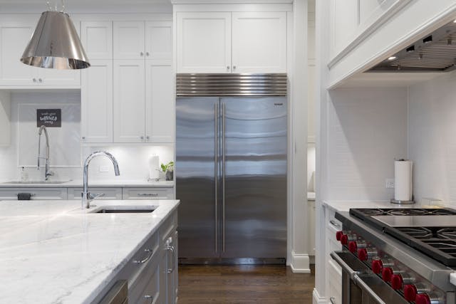 pexels-alex-qian-1180283-2343467 kitchen with white and metallic finishes